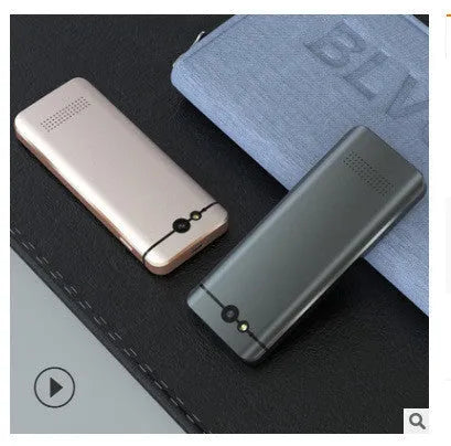 Gold and silver grey M9 WiFi translator device for iOS group chat and photo translation.