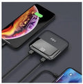 Digital display power bank with LCD screen showing battery level, compact plastic design, available in black