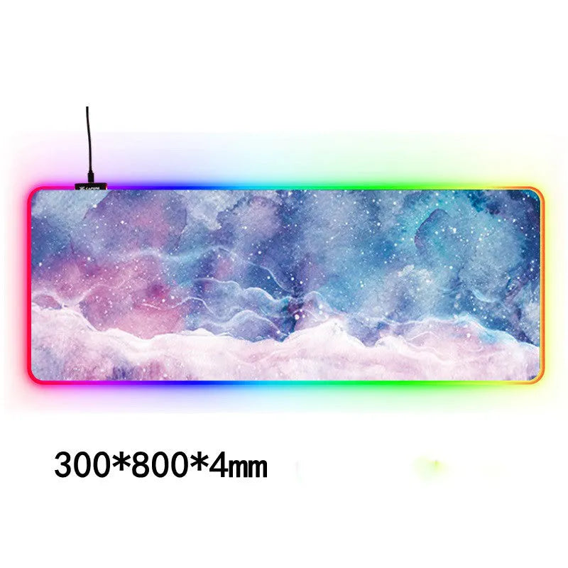 Large RGB gaming mouse pad with waterproof cloth surface and colourful stitched edge, featuring seven style options