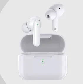 Black and white wireless in-ear Bluetooth headphones with a magnetic charging case on a table.
