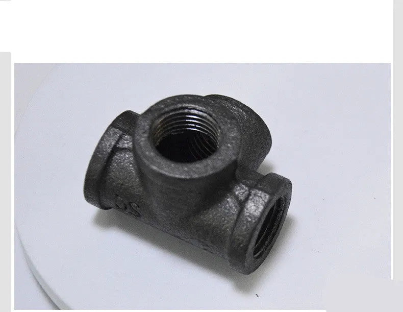 Malleable steel galvanised four-way pipe fittings for plumbing systems