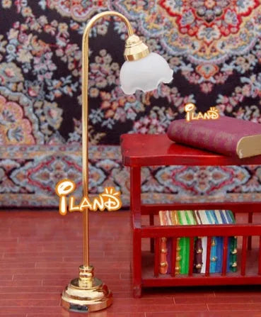 Miniature dollhouse floor lamp with flower-shaped shade and metal base for battery-powered lighting