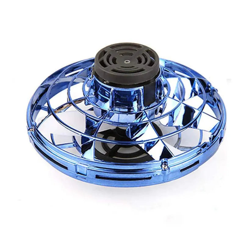 Blue rotating flying gyro induction drone toy made of plastic, 4x8cm, held in hand showing its compact size