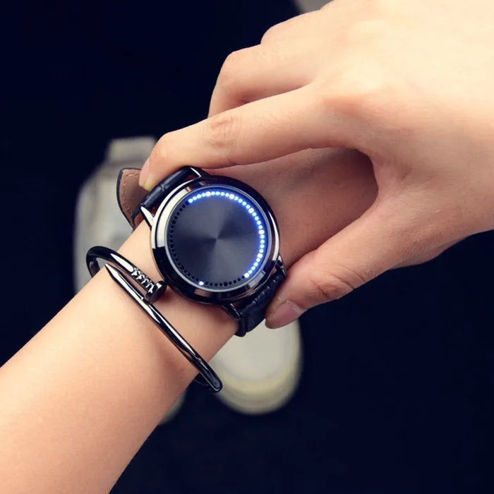 Electronic digital watch with bright blue light display showing time on black or white watch face