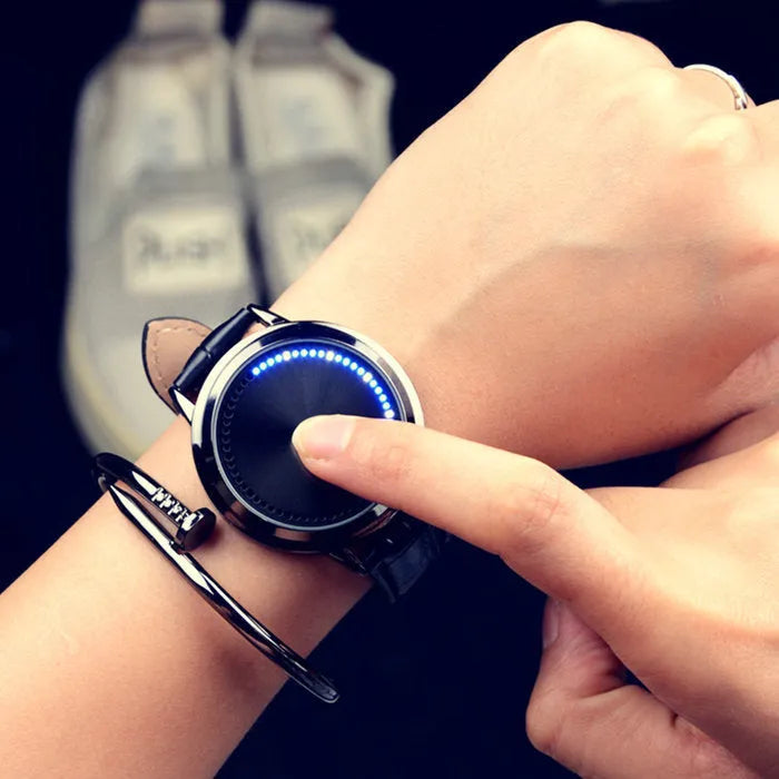 Electronic digital watch with bright blue light display showing time on black or white watch face