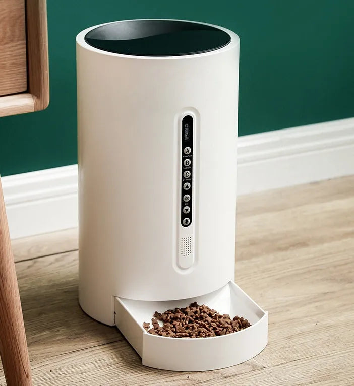 White smart pet feeder with digital timer display and food storage compartment