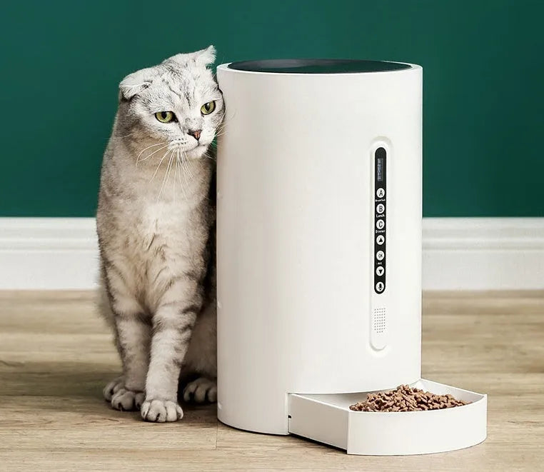 White smart pet feeder with digital timer display and food storage compartment