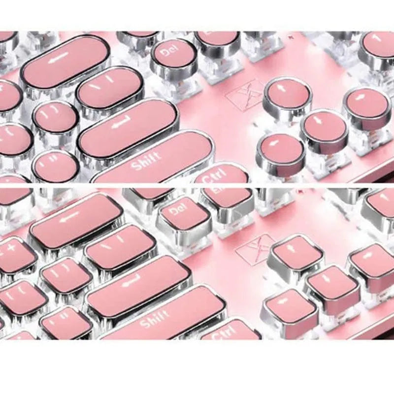 Queen Lipstick mechanical keyboard with silver base, pink keys, green switches, and a wireless mouse on a desk.