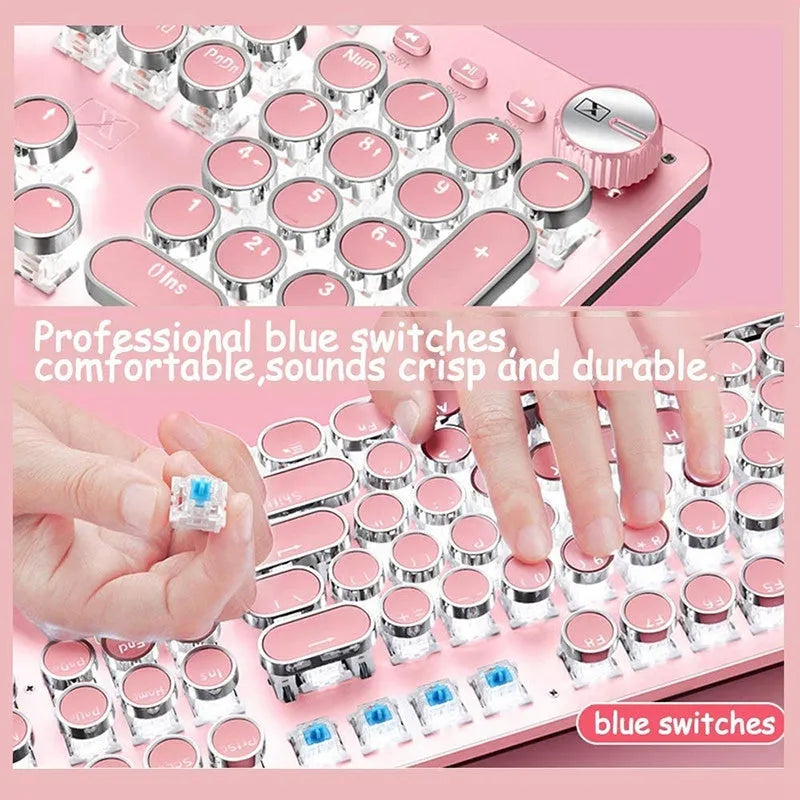 Queen Lipstick mechanical keyboard with silver base, pink keys, green switches, and a wireless mouse on a desk.