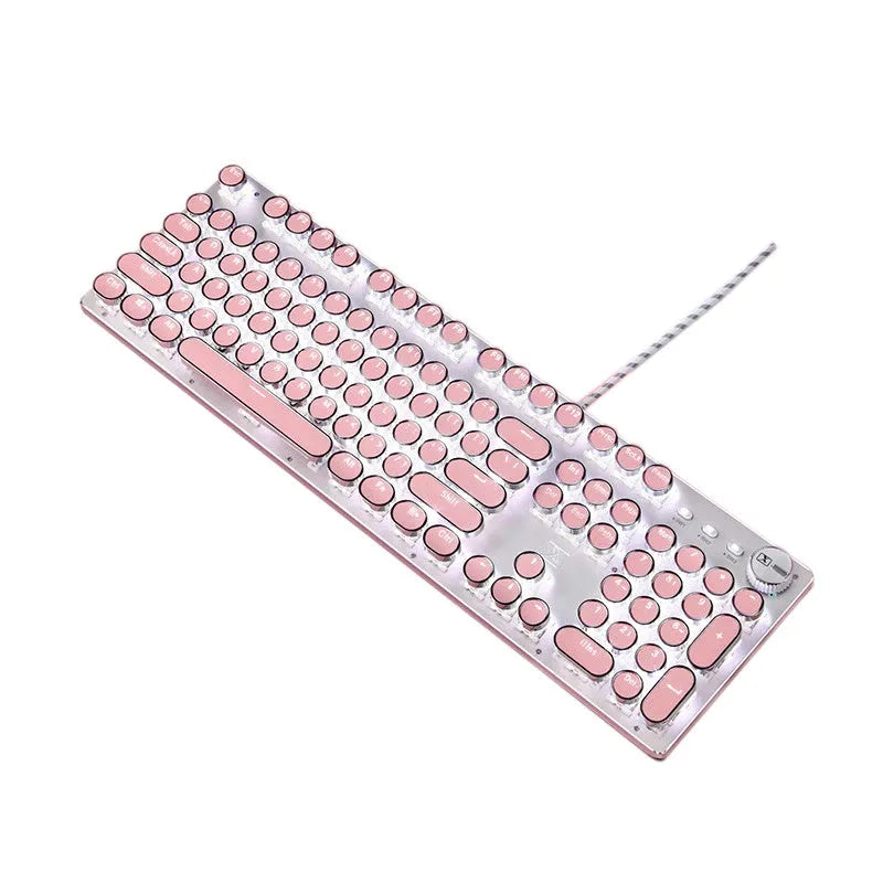 Queen Lipstick mechanical keyboard with silver base, pink keys, green switches, and a wireless mouse on a desk.