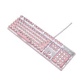 Queen Lipstick mechanical keyboard with silver base, pink keys, green switches, and a wireless mouse on a desk.