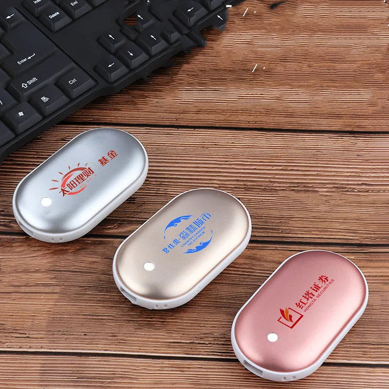 Mini winter hand warmer power bank in silver, rechargeable USB portable heater pebble design 102x58x24mm