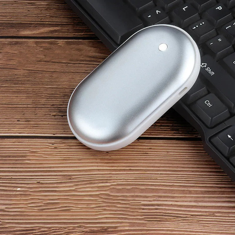 Mini winter hand warmer power bank in silver, rechargeable USB portable heater pebble design 102x58x24mm