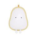 Yali pear-shaped silicone night light emitting warm yellow light on a bedside table.