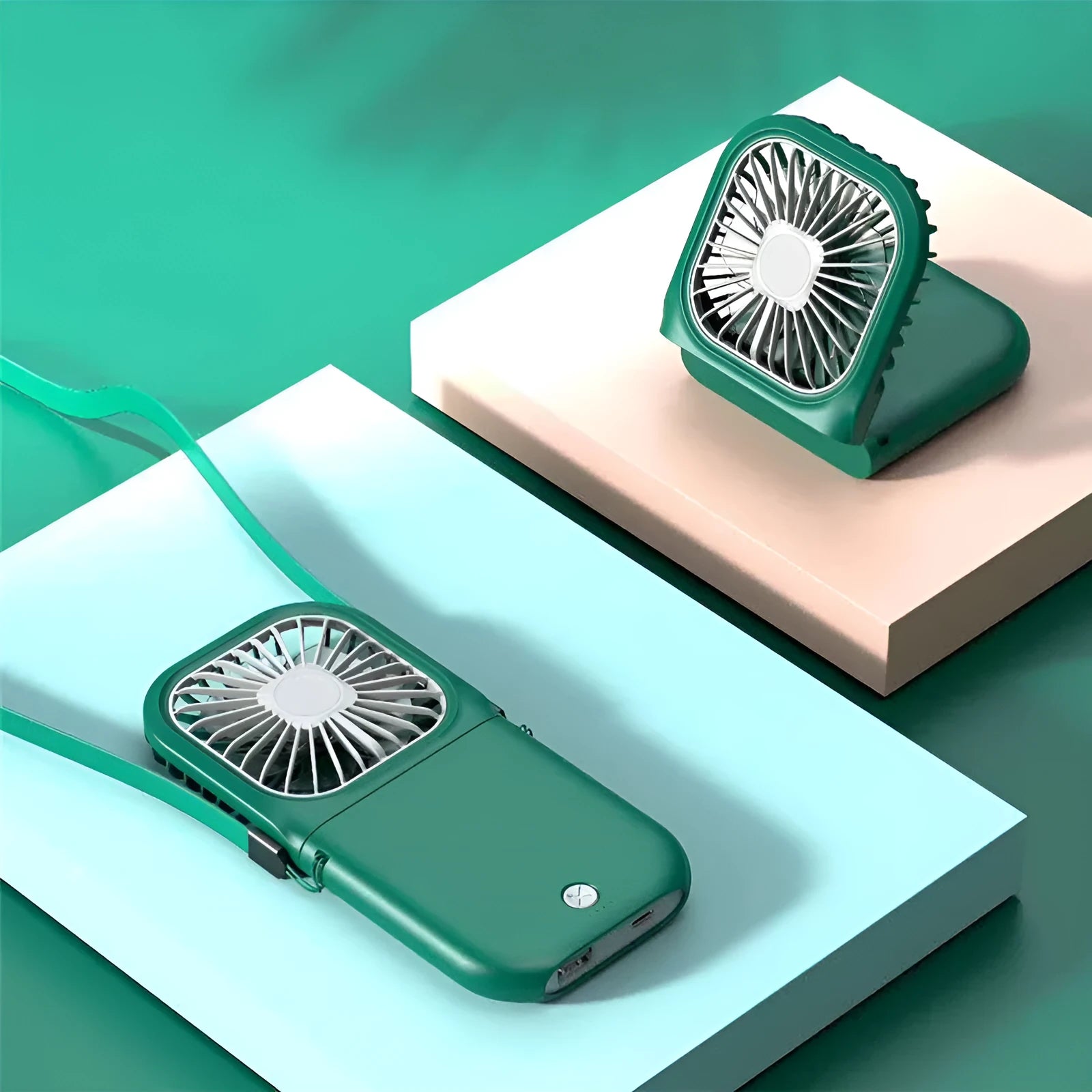 Hands-free wearable neck fan with dual blades and a lanyard, shown in multiple colour options on a table.