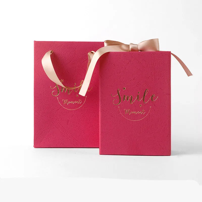 Small cardboard gift box with handbag carrier and raffia trim in blue, pink, red, or white