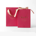 Small cardboard gift box with handbag carrier and raffia trim in blue, pink, red, or white