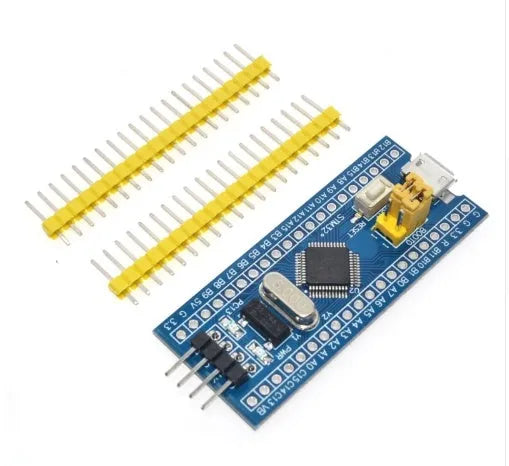 STM32F103C8T6 ARM Cortex-M3 microcontroller development board with blue PCB and pin headers.