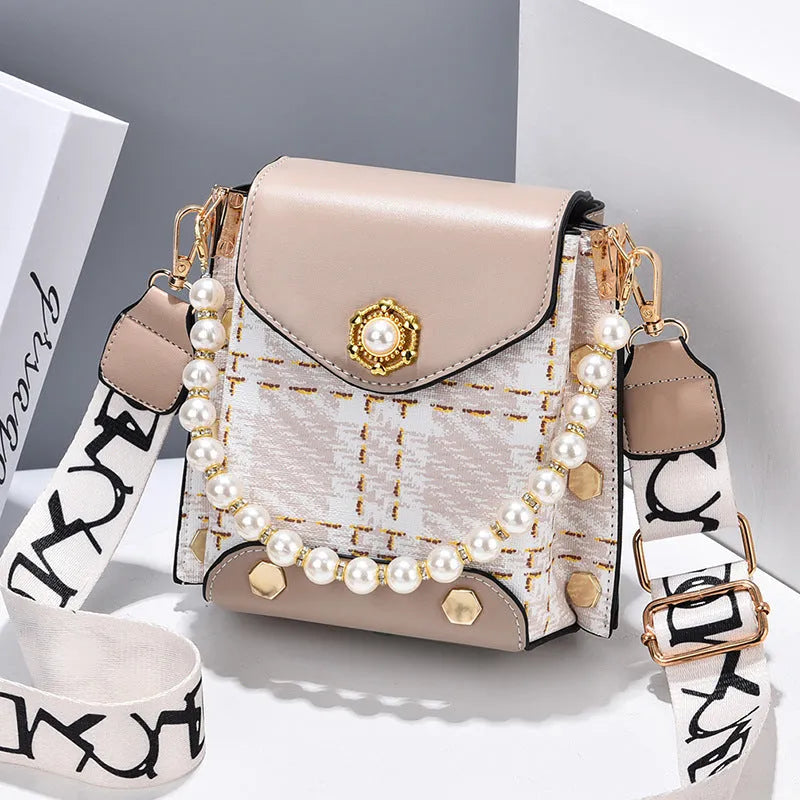 Women's crossbody phone bag in PU leather with pearl pendant and gold metal studs, magnetic flap closure
