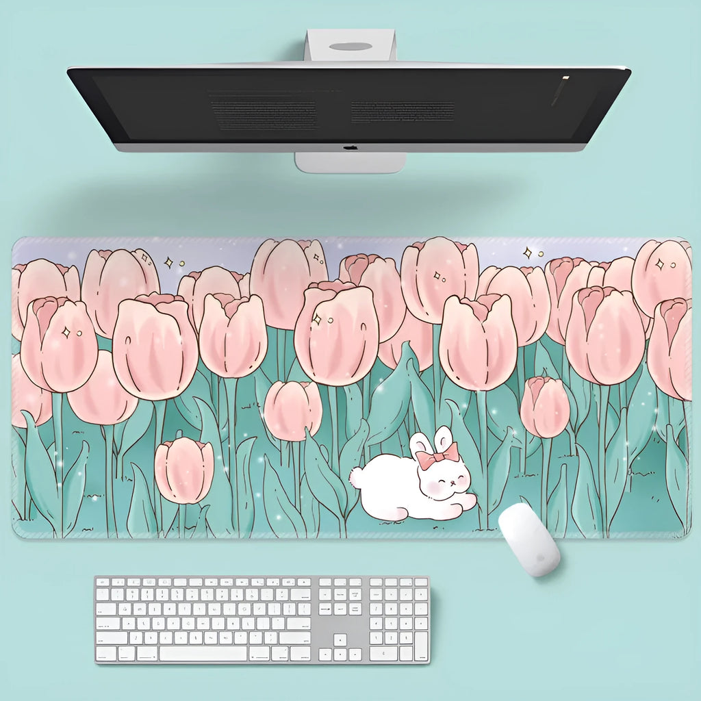 Large colourful flower pattern mouse pad on a wooden desk with keyboard and mouse.