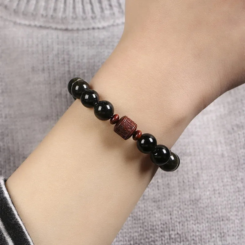 Hand-woven vintage bracelet with 10mm golden obsidian beads in retro style with national design elements