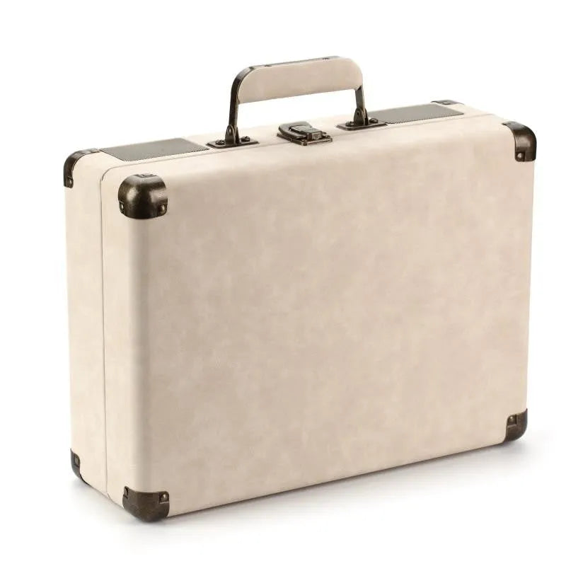 Portable Bluetooth vinyl turntable in a leather carrying case shown in multiple colour options