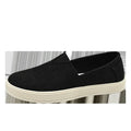 Men's beige canvas slip-on shoes with round toe and PVC sole on neutral background