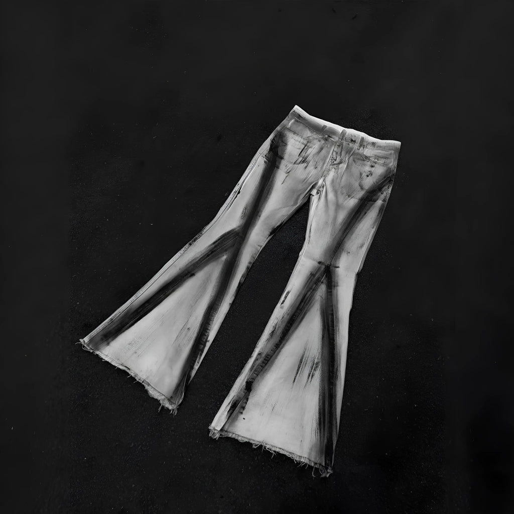 White retro-style selvedge denim jeans with a black ribbon gradient detail on the leg.