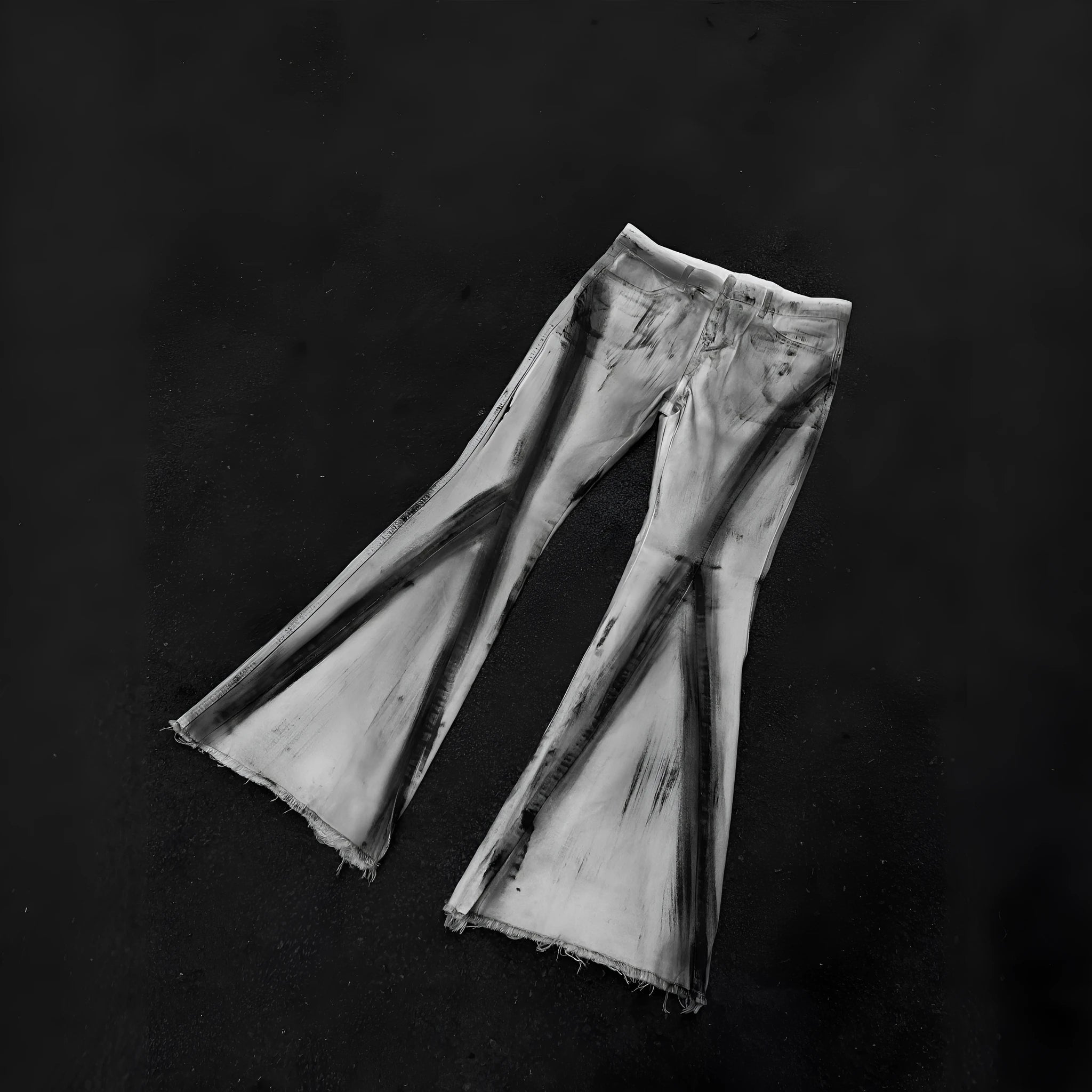 White retro-style selvedge denim jeans with a black ribbon gradient detail on the leg.