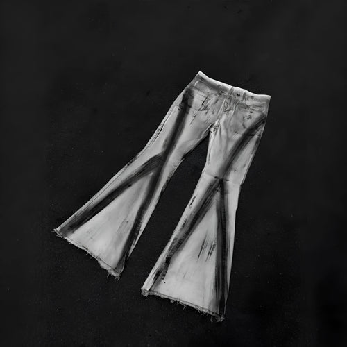 White retro-style selvedge denim jeans with a black ribbon gradient detail on the leg.