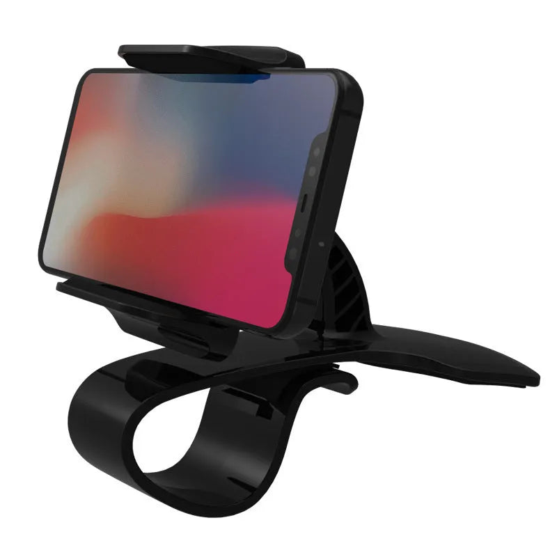 Dashboard car phone holder with silicone-grip bracket mounted on vehicle dashboard edge holding a smartphone