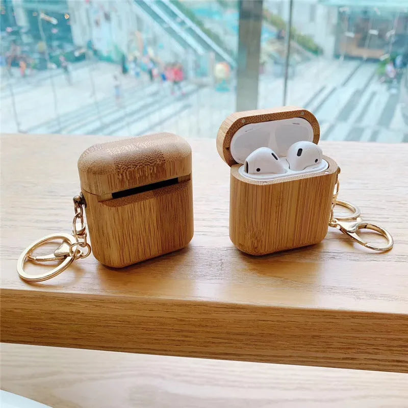 Wood grain clamshell earphone cover for AirPods 1 or 2 in carbonized wood colour, made from wood or bamboo.