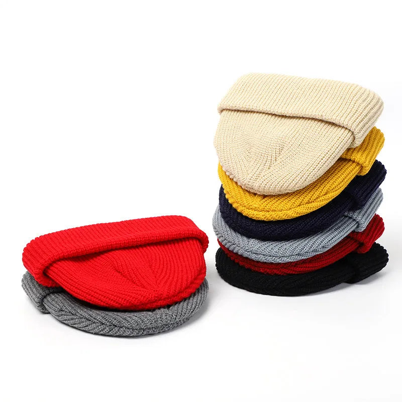 Knitted wool hat in black, claret red, grey, pink, red, white and yellow