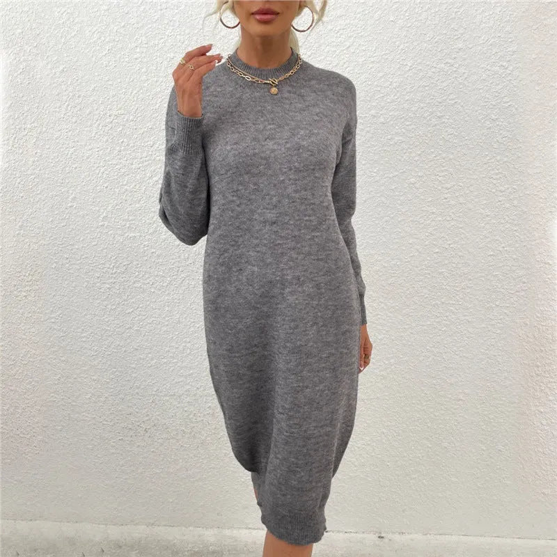 Women's grey crew neck long sleeve acrylic pullover sweater on a hanger.