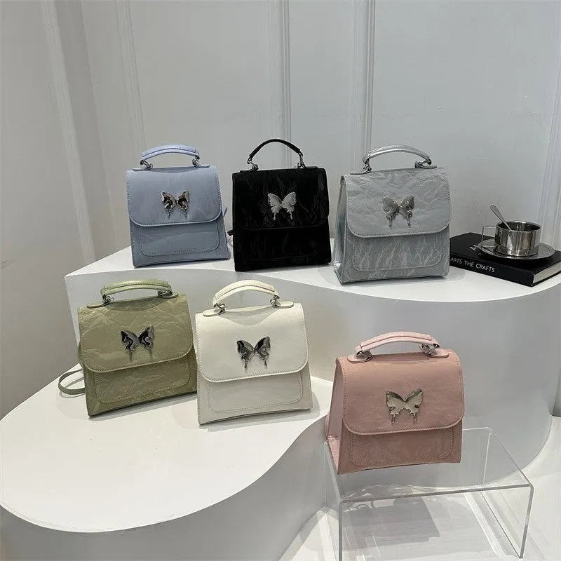 Women's preppy style PU synthetic leather backpack with bow detailing in six colour options