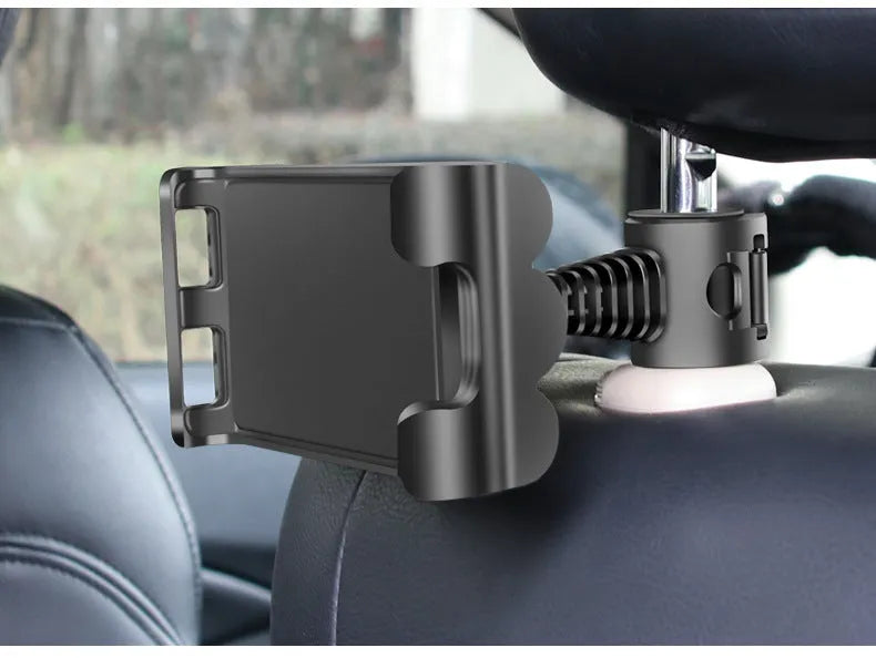 Car headrest mounting bracket holding tablet with 360-degree rotation adjustment