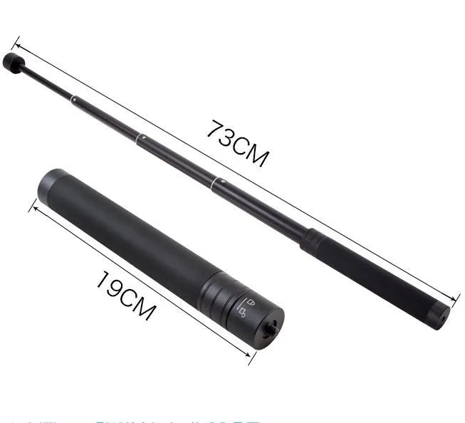 Black retractable aluminium selfie stick with phone clamp attached, shown extended and with a tripod mounted on its base.