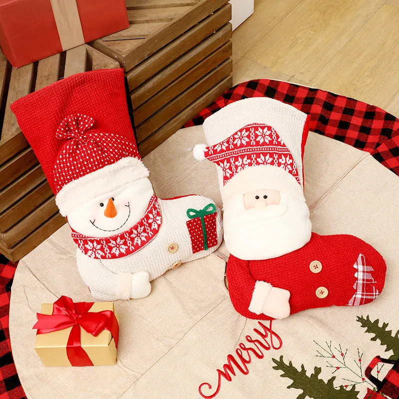 Large red and white knitted Christmas stocking with Santa Claus design for fireplace mantel decoration