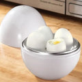 White microwave egg steamer cooker with lid for boiling up to four eggs.