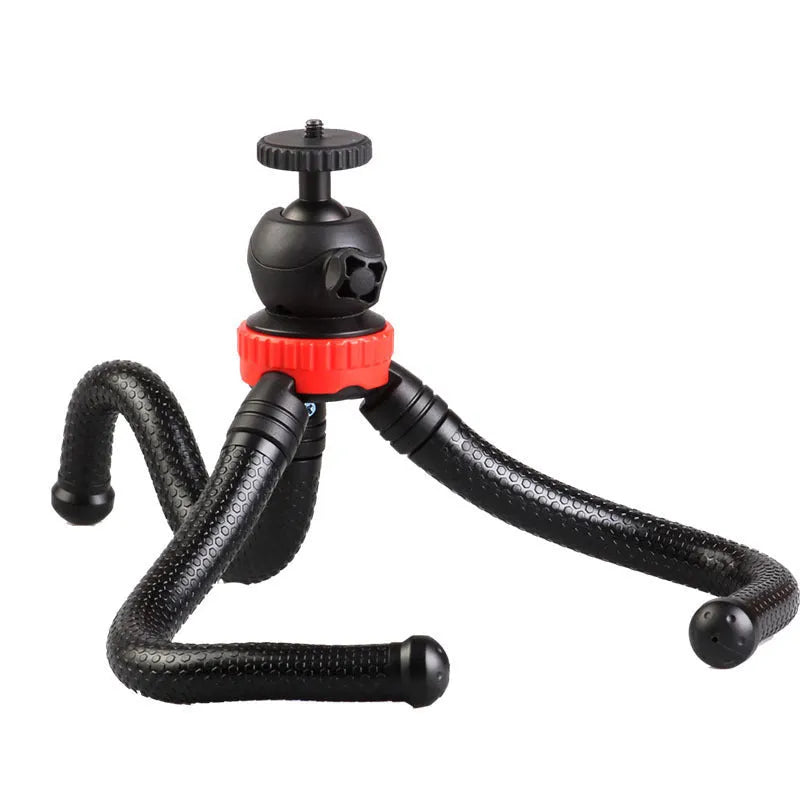 Black octopus tripod with flexible rubber legs wrapped around a pole, holding a mobile phone.