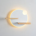 Black round bedside lamp with USB charging port on a wooden nightstand.