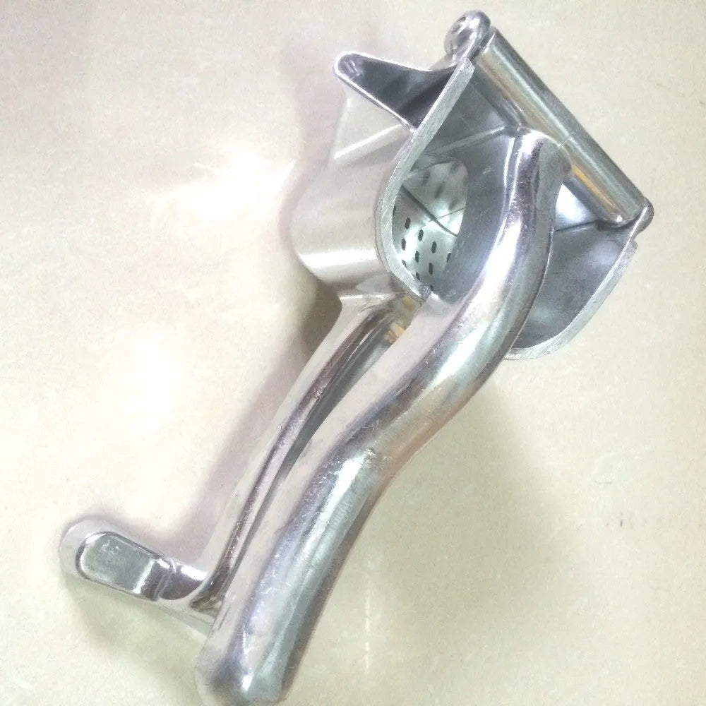 Silver heavy duty lemon squeezer with large bowl on a kitchen counter