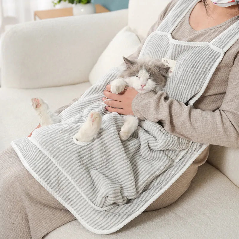 Cloth cat petting apron in a striped pattern, shown worn by a person holding a cat.
