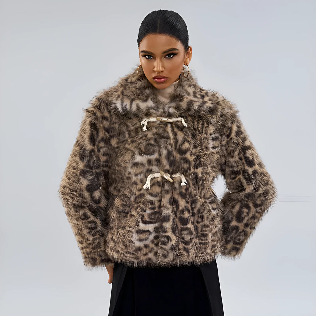 Women's leopard print coat with a buckle lapel closure on a hanger.