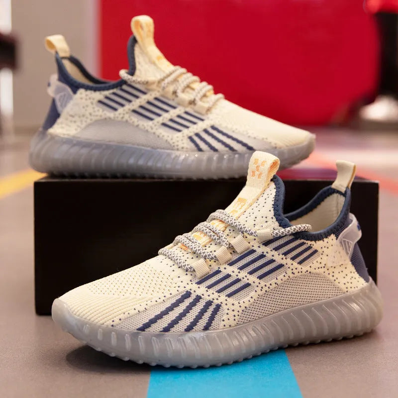 Men's white breathable flying fabric sports shoes with mesh lining and low upper design on a plain background.