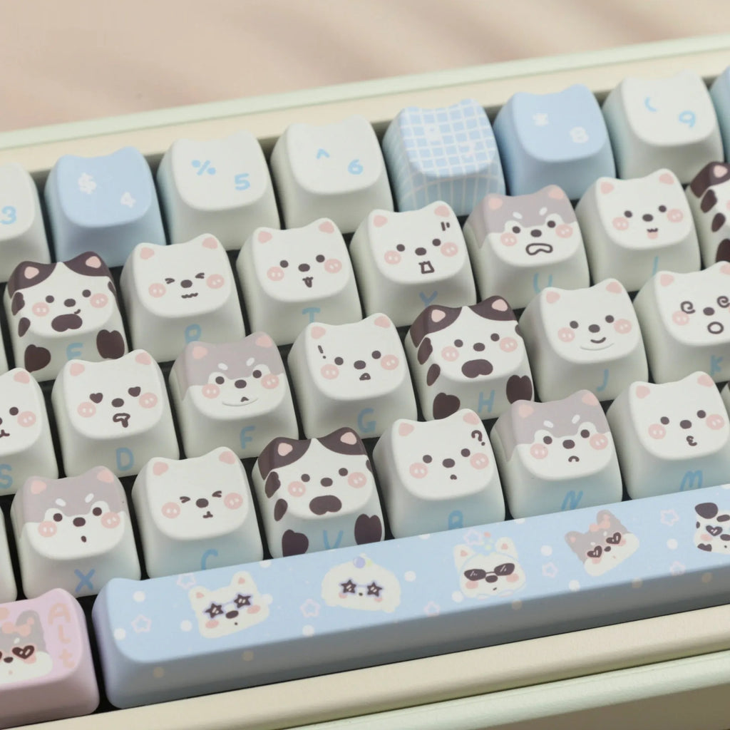 Colourful PBT key cap set for mechanical keyboards with printed cat and puppy designs.