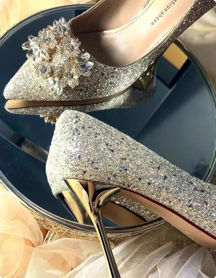 Champagne coloured pointed toe bridal shoes with rhinestone decoration and fine heel
