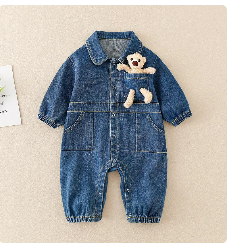 Baby boy wearing blue denim jumpsuit with teddy bear accessory, western style for Spring Festival