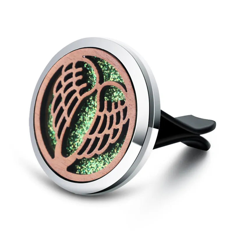 Round car vent aromatherapy clip in alloy wood construction showing hollow centre for incense