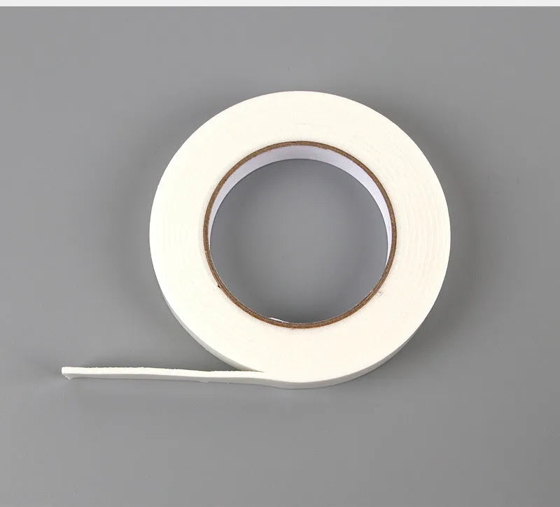 Roll of white foam double-sided adhesive tape showing its 3mm thickness and strong adhesive.